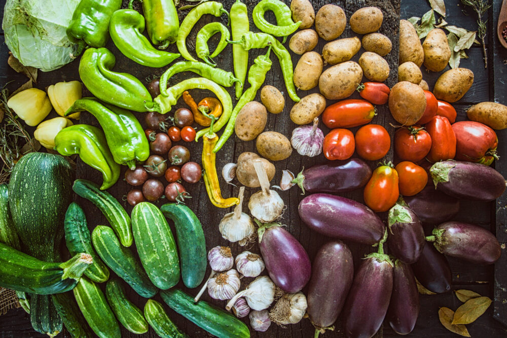 Vegetables on wood. Organic vegetables in rustic setting. Fresh food. Healthy veggies